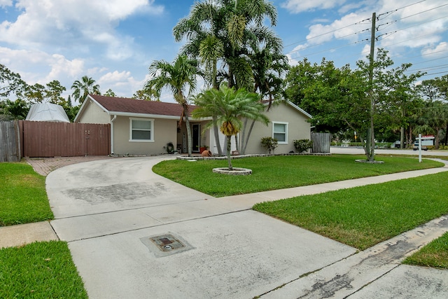 ranch-style house with a front lawn