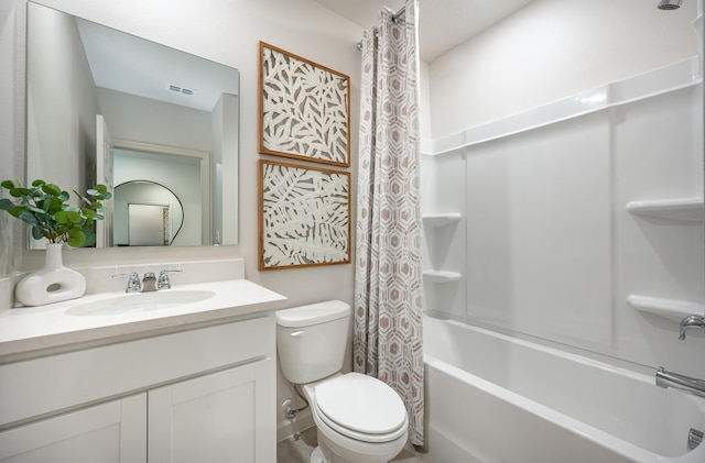 full bath featuring vanity, shower / bath combo with shower curtain, toilet, and visible vents