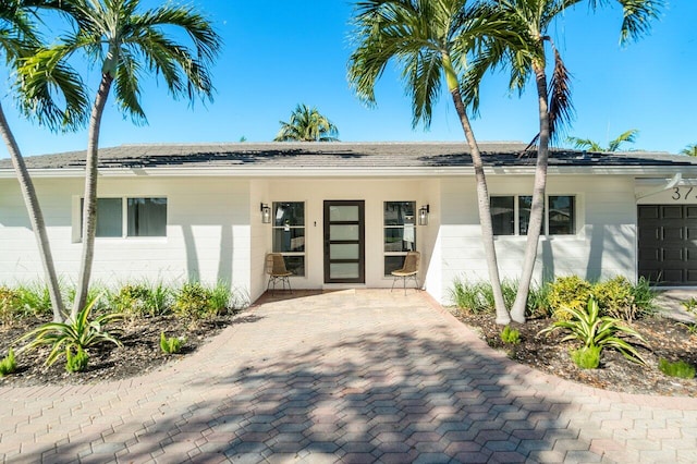 doorway to property featuring a garage