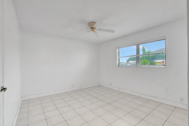 tiled empty room with ceiling fan