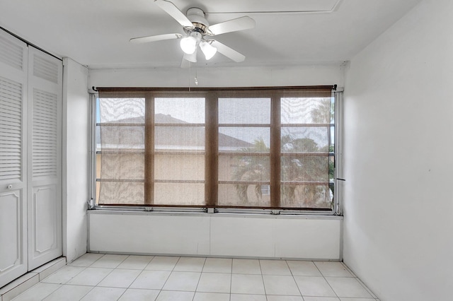 unfurnished sunroom with ceiling fan and plenty of natural light