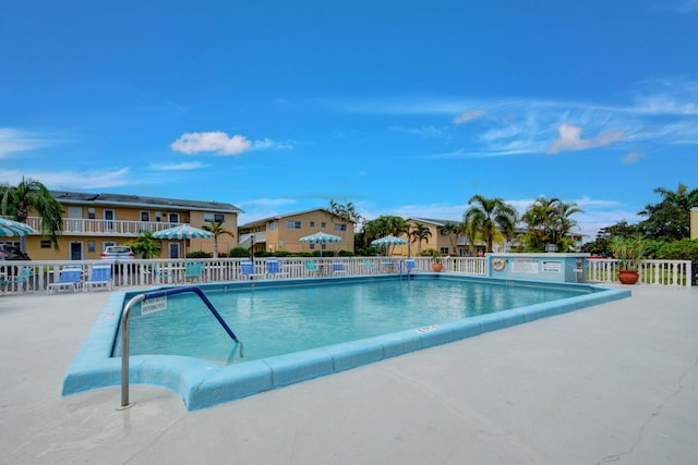 view of swimming pool with a patio