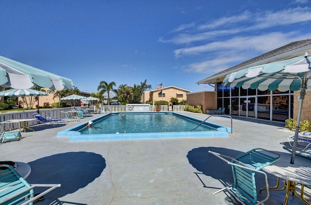 view of swimming pool featuring a patio