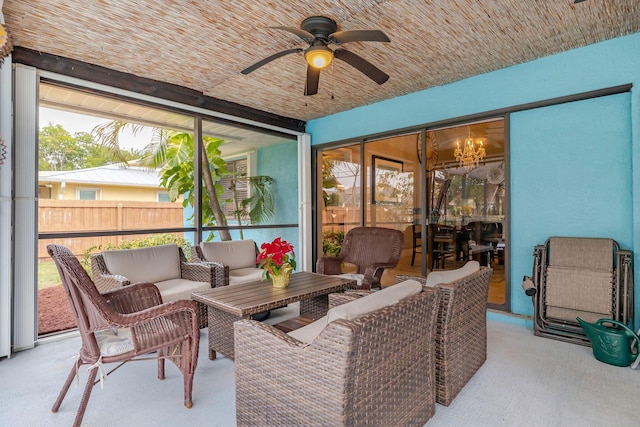 sunroom with ceiling fan