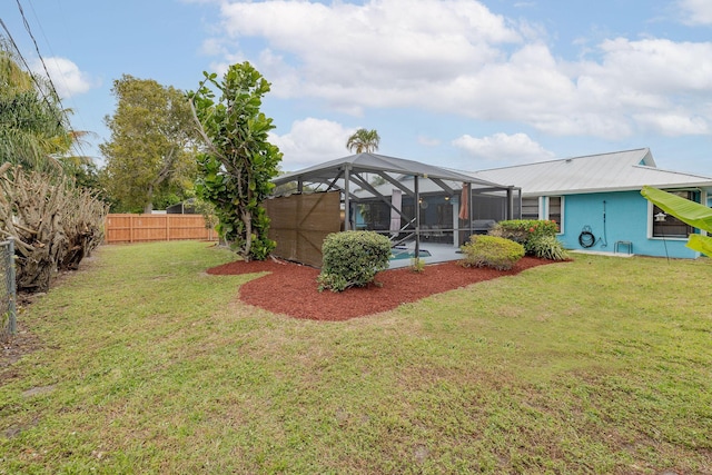 view of yard featuring a pool and a lanai