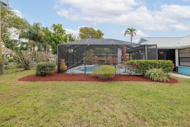 view of yard with glass enclosure