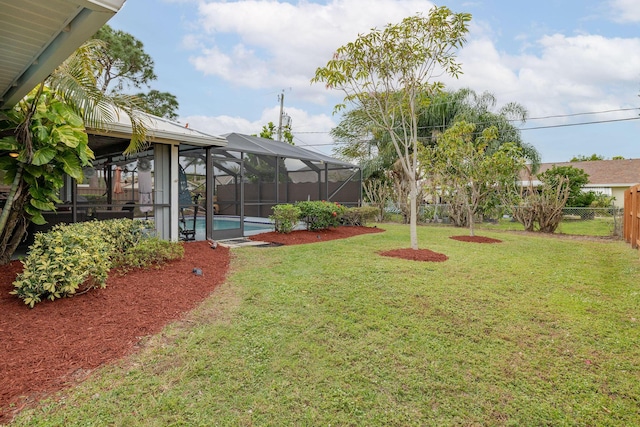 view of yard with a lanai