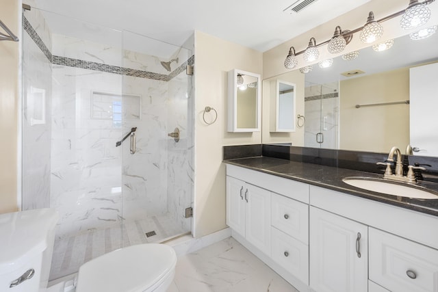 bathroom with walk in shower, vanity, and toilet