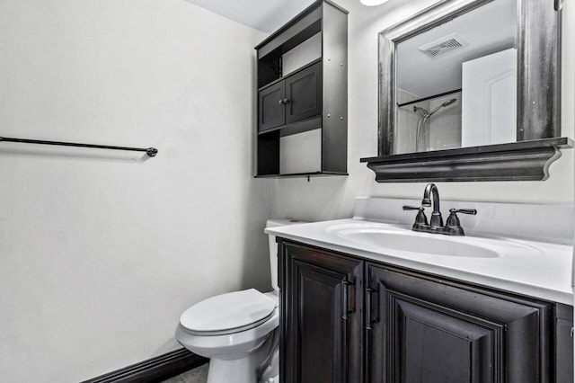 bathroom with toilet and vanity