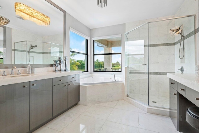 bathroom with vanity, independent shower and bath, and tile patterned flooring