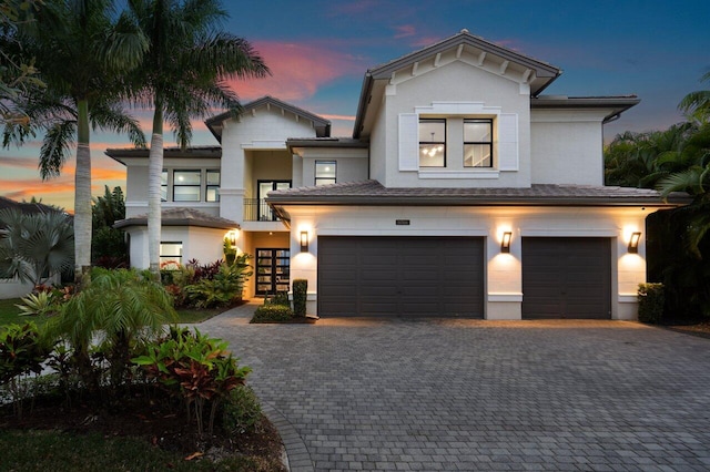 9748 Rennes Ln, Delray Beach, FL 33446 - property entrance featuring french doors, a balcony, and stucco siding