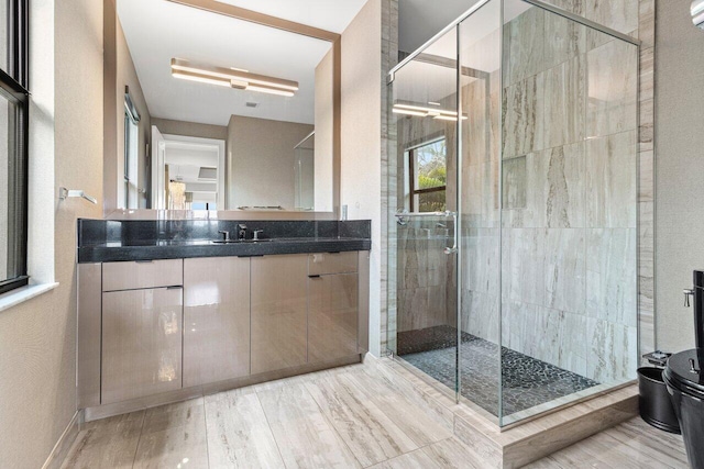 9748 Rennes Ln, Delray Beach, FL 33446 - bathroom with vanity, a stall shower, and wood finished floors