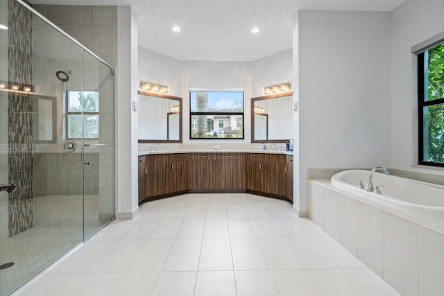 bathroom with vanity, separate shower and tub, and tile patterned flooring