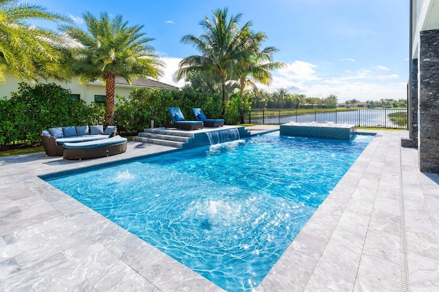 view of pool featuring a patio, an outdoor hangout area, pool water feature, and a water view