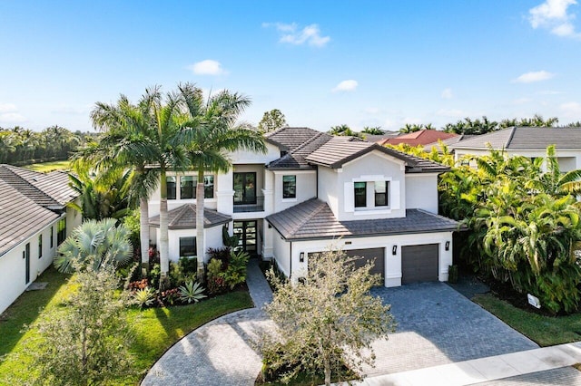 view of front of home with a garage and a front yard