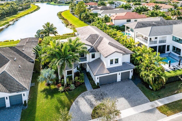 birds eye view of property with a water view