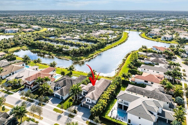 birds eye view of property featuring a water view