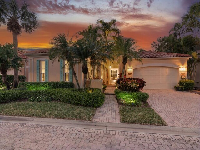 mediterranean / spanish-style home featuring a garage