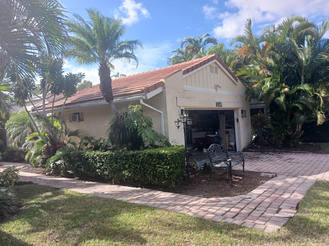 view of side of home featuring a garage