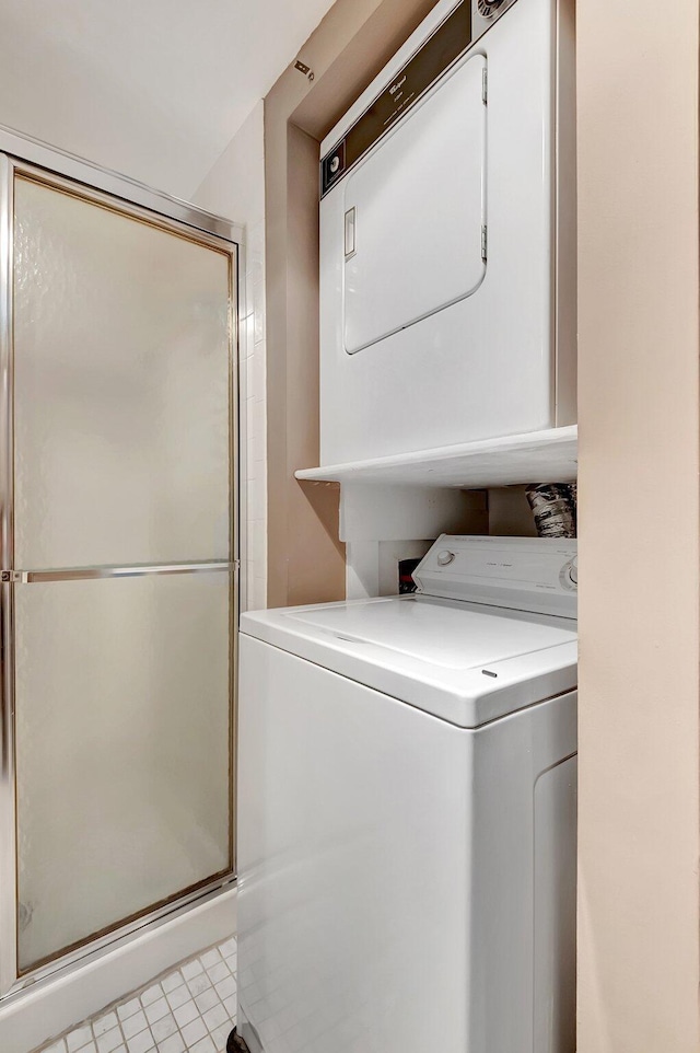 laundry area with laundry area and stacked washing maching and dryer