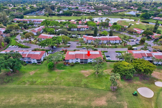 birds eye view of property with a residential view, a water view, and golf course view