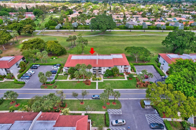 aerial view with golf course view and a residential view