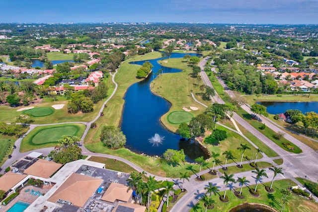 birds eye view of property featuring golf course view, a water view, and a residential view