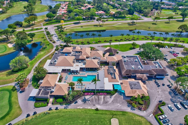 birds eye view of property featuring a residential view, a water view, and golf course view