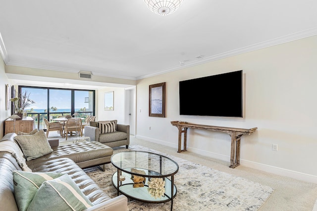 living room with ornamental molding and light colored carpet