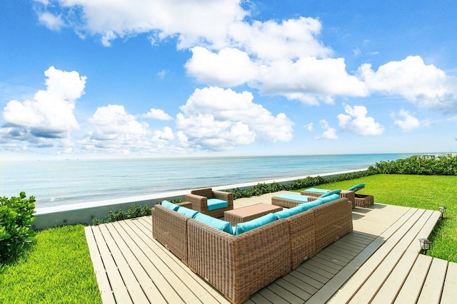 wooden terrace featuring a water view, an outdoor hangout area, and a lawn