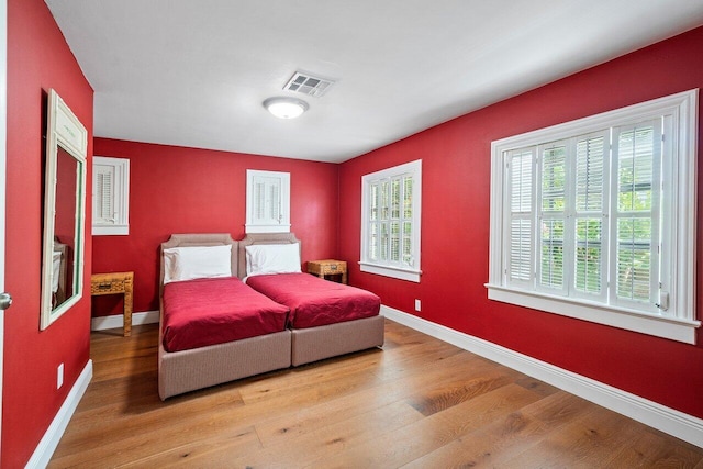 bedroom with light hardwood / wood-style flooring