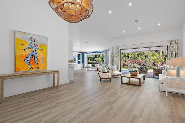 189 Shelter Ln, Jupiter Inlet Colony, FL 33469 - living room featuring a high ceiling, light wood-style flooring, visible vents, and recessed lighting