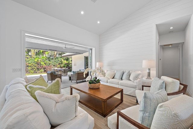 189 Shelter Ln, Jupiter Inlet Colony, FL 33469 - living room featuring high vaulted ceiling, light wood finished floors, recessed lighting, and wooden walls