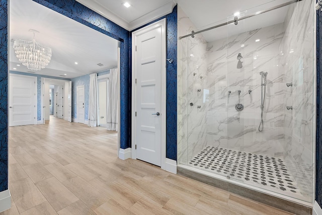 bathroom with walk in shower and a notable chandelier