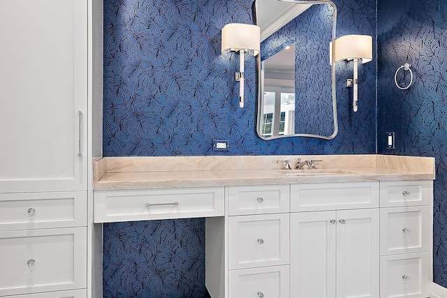 bathroom with vanity and ornamental molding