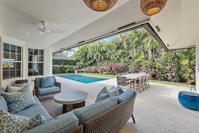 189 Shelter Ln, Jupiter Inlet Colony, FL 33469 - view of patio / terrace with outdoor dining space, a fenced in pool, ceiling fan, and an outdoor living space