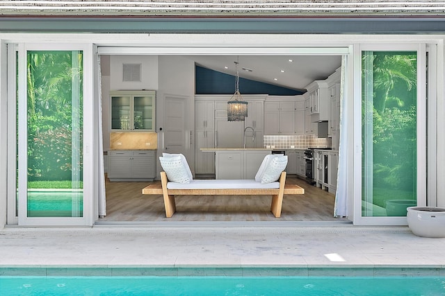 view of pool with a patio and sink