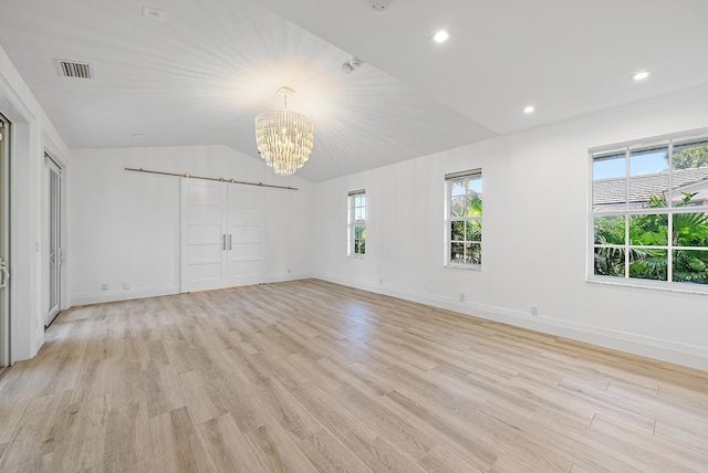 189 Shelter Ln, Jupiter Inlet Colony, FL 33469 - unfurnished bedroom with a chandelier, light wood-style floors, vaulted ceiling, and recessed lighting
