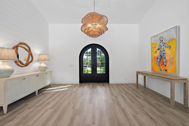 189 Shelter Ln, Jupiter Inlet Colony, FL 33469 - foyer entrance featuring wood finished floors, baseboards, and french doors