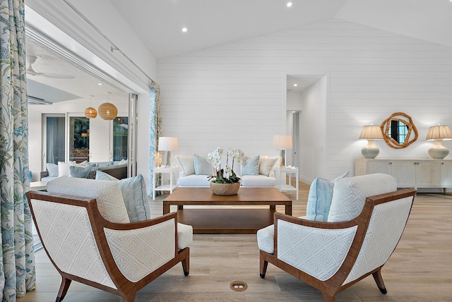 189 Shelter Ln, Jupiter Inlet Colony, FL 33469 - sitting room with high vaulted ceiling, wood walls, and light wood finished floors