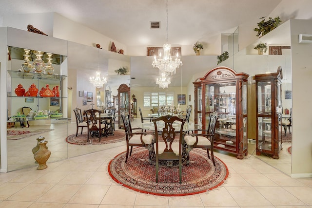 dining room featuring a high ceiling, light tile patterned floors, and an inviting chandelier