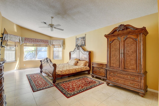 tiled bedroom featuring ceiling fan, a textured ceiling, and lofted ceiling