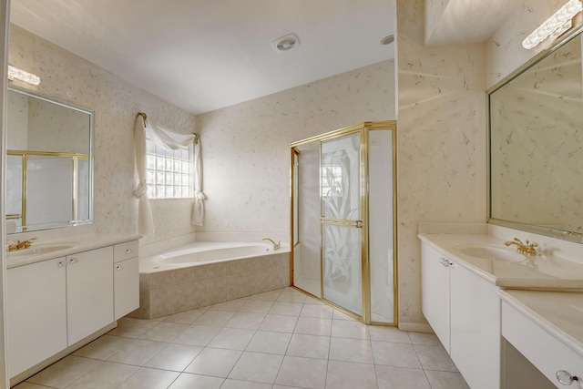 bathroom featuring tile patterned floors, vanity, and shower with separate bathtub