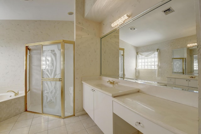 bathroom with plus walk in shower, tile patterned flooring, and vanity