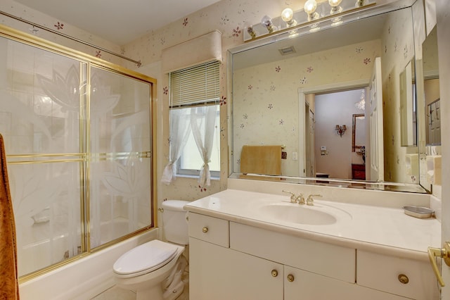 full bathroom with toilet, enclosed tub / shower combo, and vanity