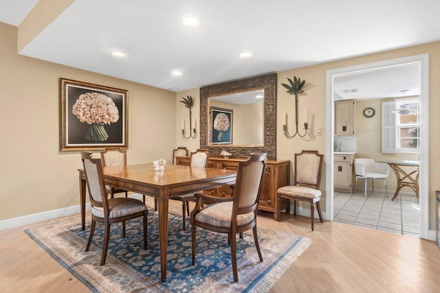 dining area with light hardwood / wood-style flooring