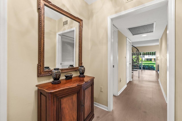 corridor featuring light hardwood / wood-style flooring