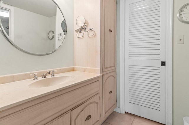 bathroom with tile patterned flooring and vanity