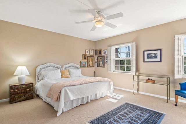 bedroom with light colored carpet and ceiling fan