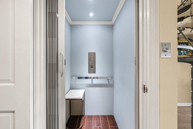 bathroom with ornamental molding and elevator